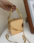 Metal Luxe Box Clutch featuring a thick gold tone chain